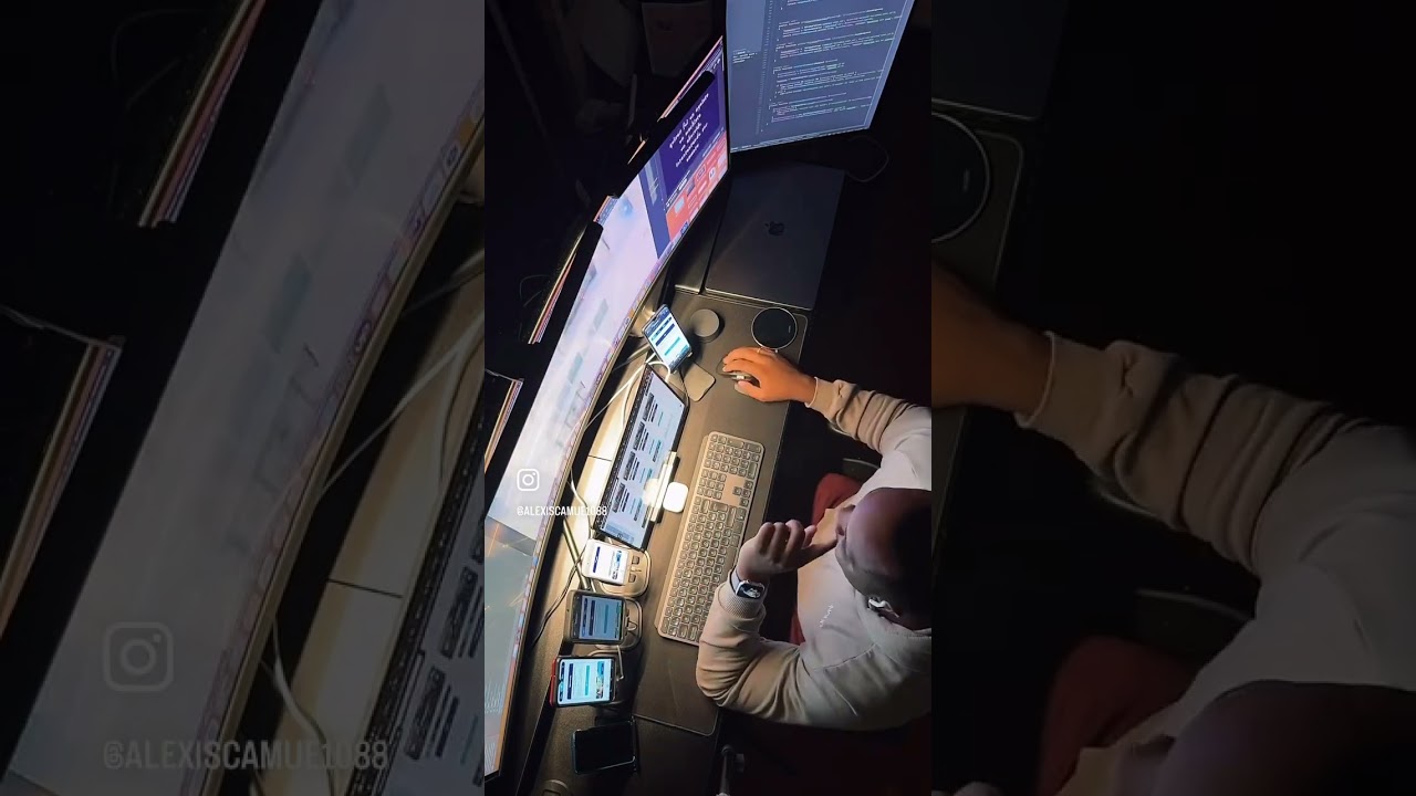 Alexis Camué working at a multi-screen mobile development setup